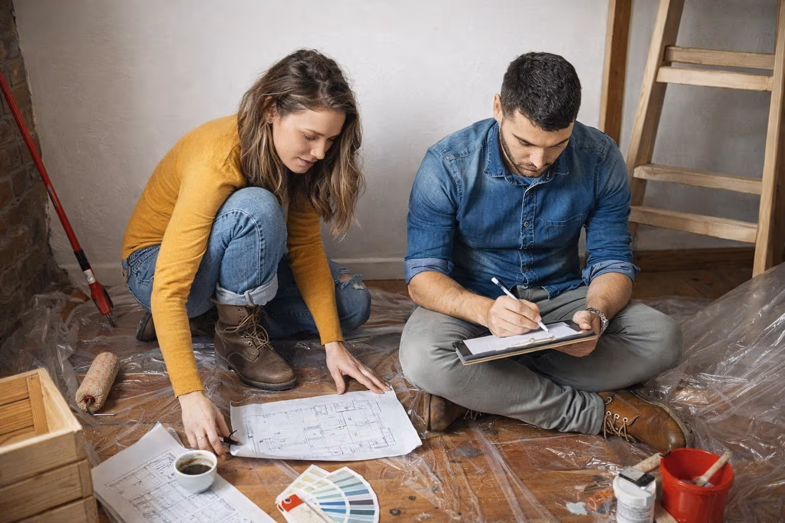 blog-couple-reviewing-blueprints