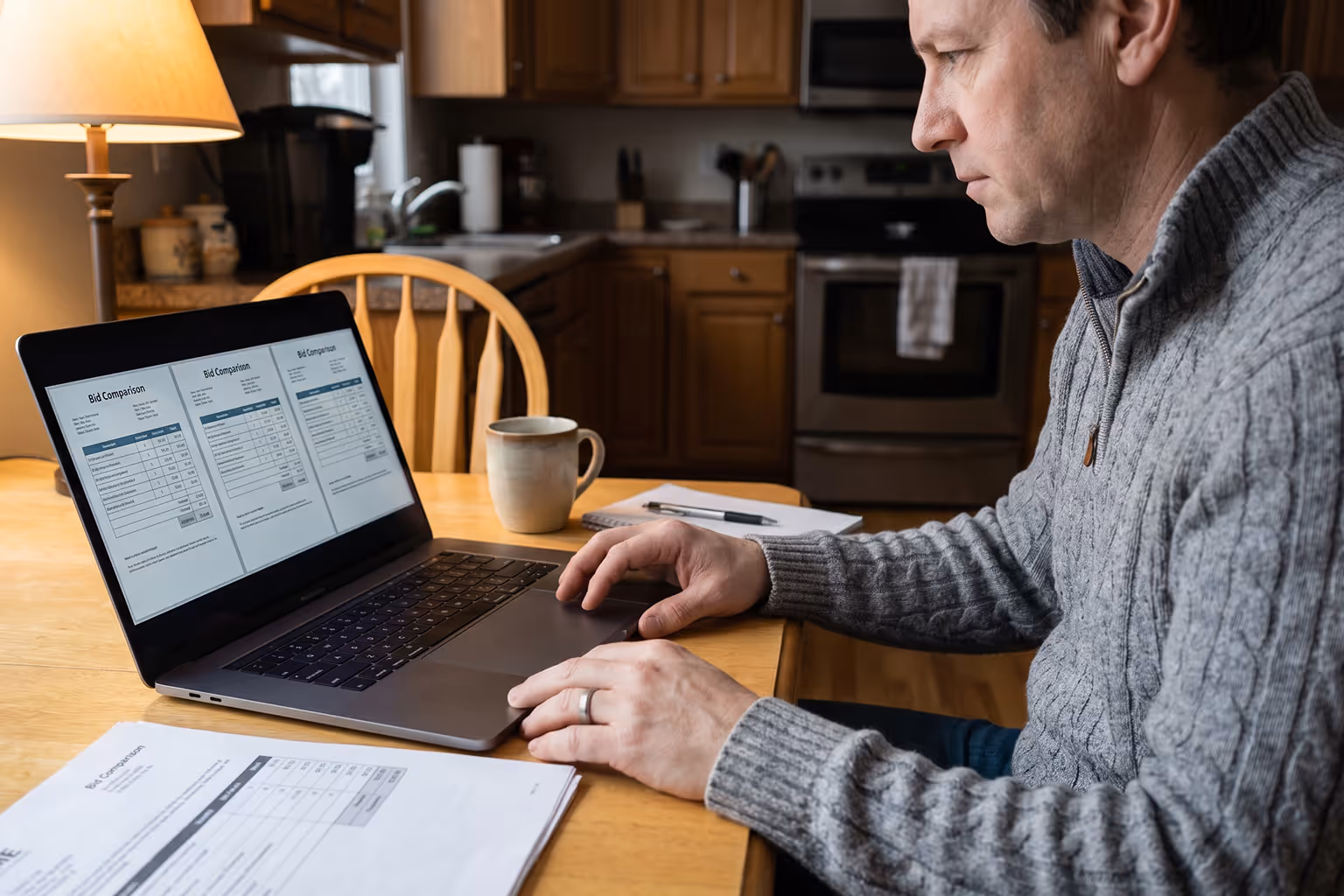 blog-homeowner-laptop-comparing-bids